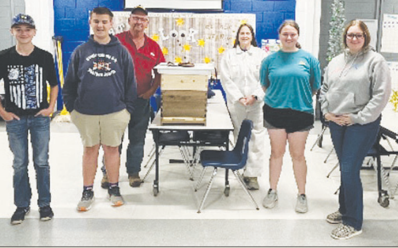 Pictured from left to right are Coltyn New, Wyatt James, Gunnar Frank, Beekeepers Robert Fojtik and Stephanie Fojtik, Jana Justiss, Addyson James, and Emerson Flessner. Contributed photo.