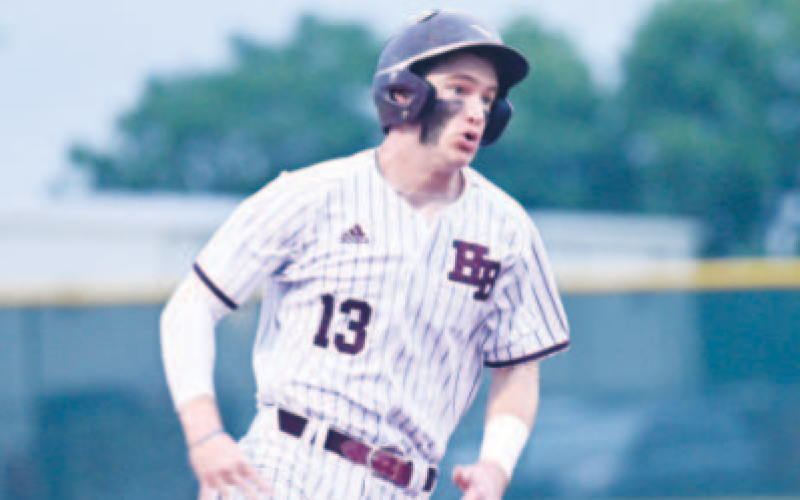 Monte Thigpen rounds third and heads for home en route to scoring a run in Game 1. Chuck Grafe/Tribune-Herald