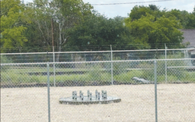 The new cell tower will be located across from Block 2 next to 701 Front Street. The concrete foundation is poured along with a perimeter fence around it.