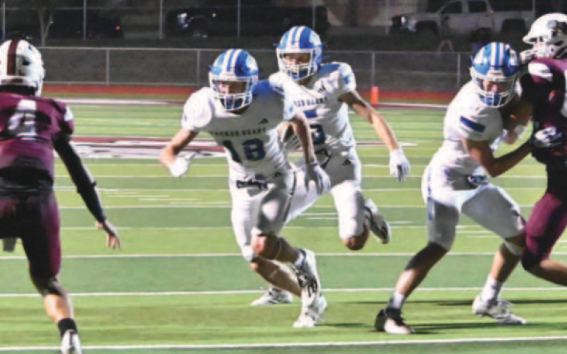 Halfback Riley Haas (5) en route to the game-winning touchdown. PHOTO CREDIT MELISSA KUTAC