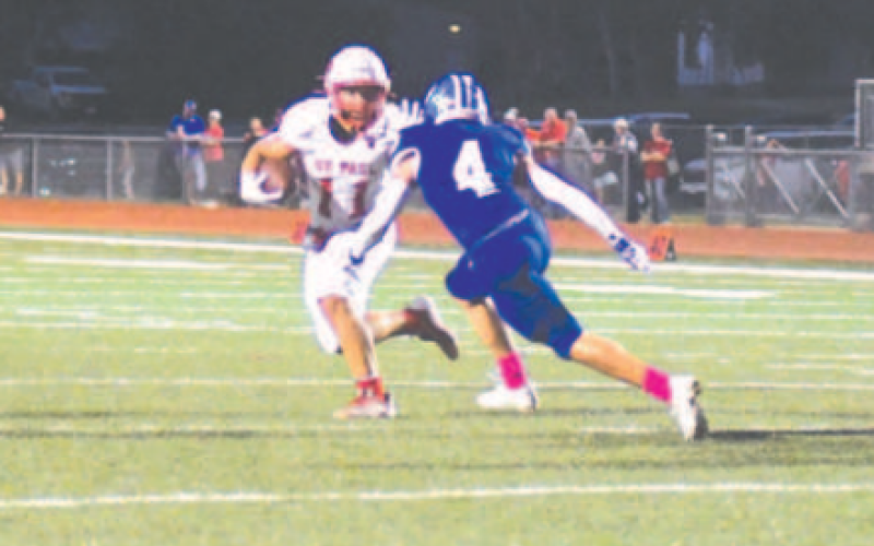 Marcus Seger (4) closes in on St. Paul’s Sam Perez. Chuck Grafe/Tribune-Herald