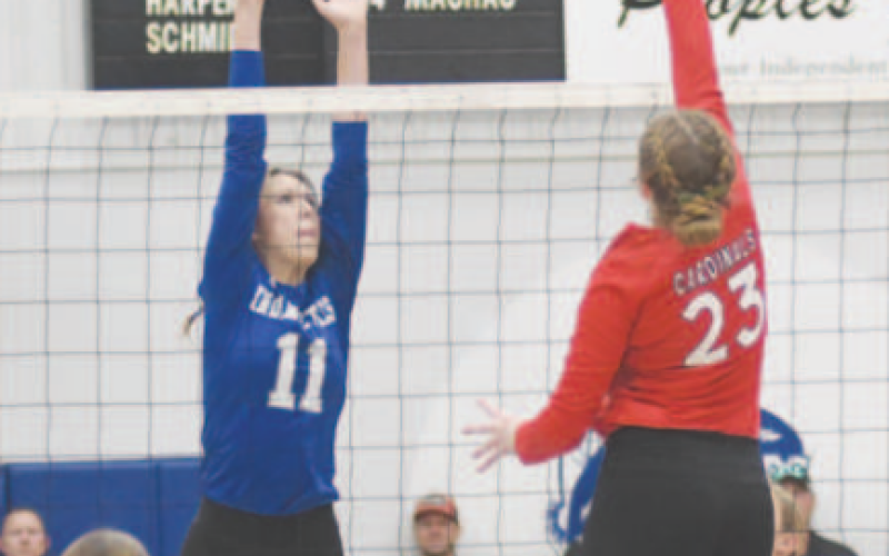 Mallory Mueller (11) attempts to block St. Paul’s Emery Kennedy,\. Chuck Grafe/Tribune-Herald