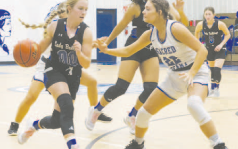 Kaycee Schindler guards Yoakum’s Emma Fling. Kasey scored a game-high 10 points. Chuck Grafe/Tribune-Herald
