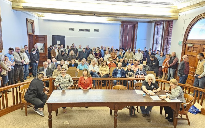 Quite the New Year's Day turnout, considering it was the second oath ceremony held that at the courthouse. Several more were also standing just outside the courtroom in the foyer. Photo by Bobby Horecka