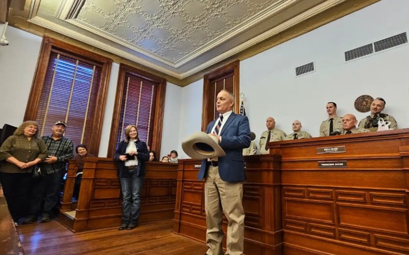 Sheriff Greenwell greets the nearly 200 people who packed the Lavaca County courtroom last Wednesday afternoon, shortly before he and each of his deputies took their respective oaths of office. He thanked the crowd, especially those who had driven some distance to take part.  Green, a retired agent with Homeland Security, greeted several people who were still actively working with that agency. Photo by Bobby Horecka