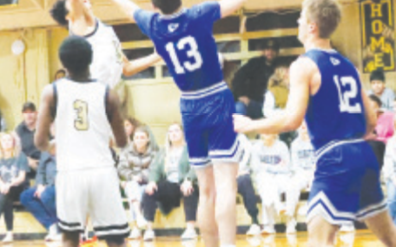 Shooter Laqua (13) fights to gain possession of the ball. Chuck Grafe/TribuneHerald