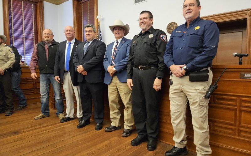Police chiefs from each of Lavaca County's four cities, including, from left, Chief Daniel Beyer, Moulton PD; Chief Karl Van Slooten, Yoakum PD; Lavaca County Judge Keith Mudd; Sheriff Greenwell; Chief Randy Schlauch, Hallettsville PD; and Chief Wayne Denson, Shiner PD. Photo by Bobby Horecka