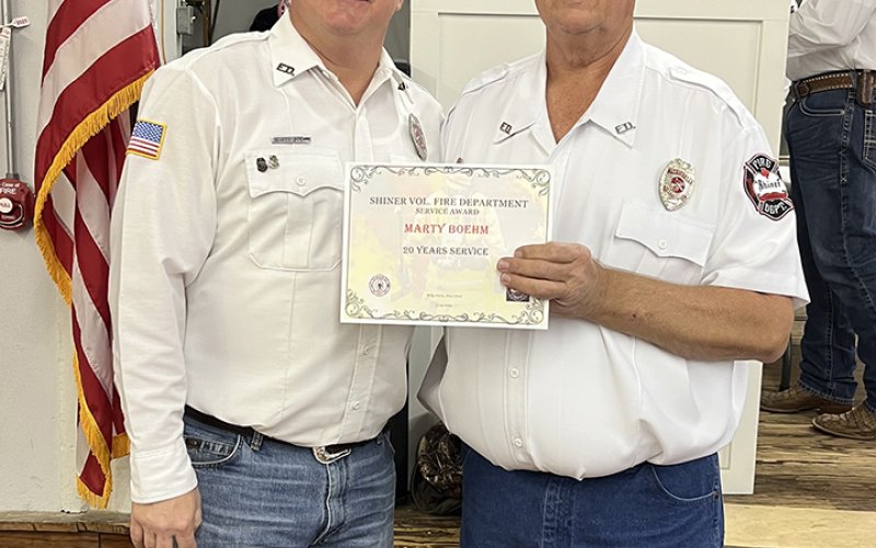 Marty Boehm (20 years), left and Daniel Muehlstein, president of the SVFD.