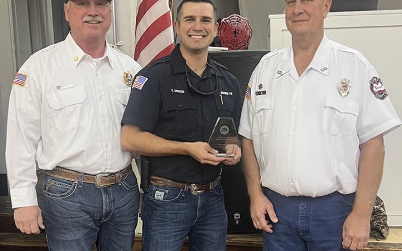 The Ernst Wangemann Award of Excellence was presented to Tim Decker. Pictured with Tim are Chief Billy Petru, left, and Daniel Muehlstein, president of the SVFD, right.