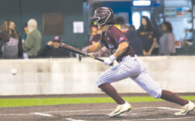 Jake Ressler puts down a successful sacrifice bunt. Chuck Grafe/Tribune-Herald