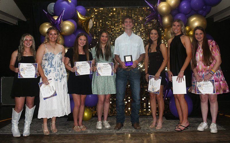 2025-2026 Cheerleader Beau. Beau is Chase Malinovsky (fourth from right). Also shown is MaKenna Pish (left), Olivia Akin (second from left), Kacy Kramer (third from left), Bianca Rainosek (fourth from left), Tawni Shelton (third from right), Addy Siegel (second from right) and Valerie Bordovsky (right). Photo by Mark Lube.