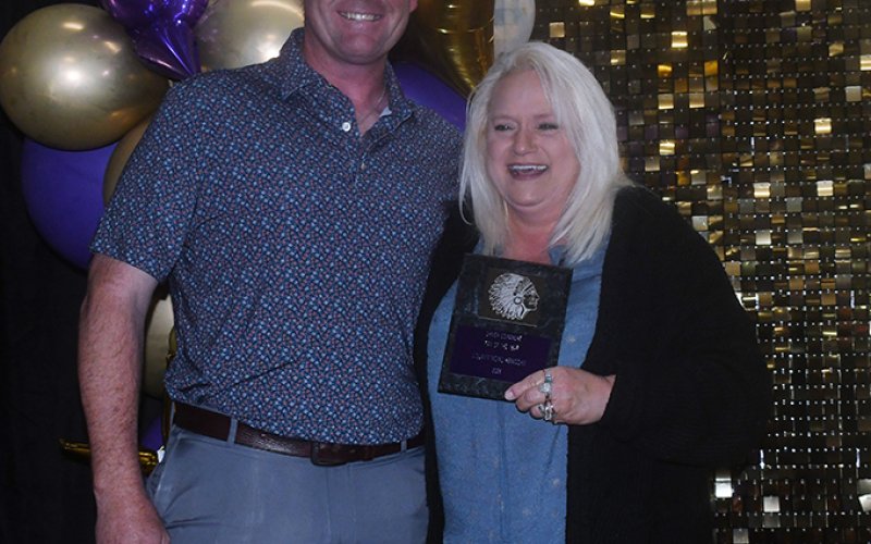 2025-2026  Fan of the Year award winner Louann Heinsohn (right). Also shown is Randy Christensen (left).  Photo by Mark Lube.
