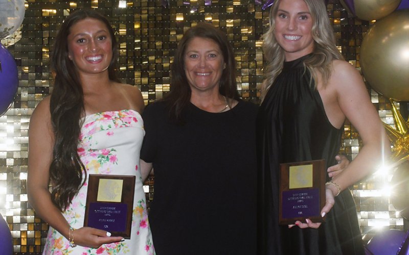 2025-2026 Female Most Outstanding Athlete award winners Kylynn Ramirez (left) and Addy Siegel (right). Also shown is Desiree Nitsch (center)  Photo by Mark Lube.