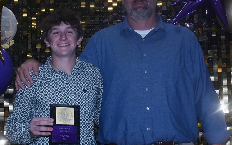 2025-2026 Comanche Hustle  award winner Aaron Migl (left). Also shown is Jeff Akin (right).  Photo by Mark Lube.