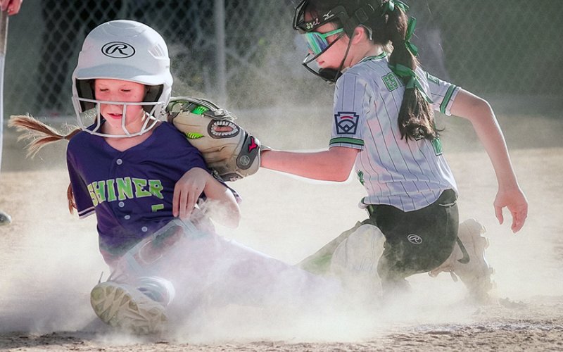 A Shiner runner attempts to avoid a tag out by Luling in the Shiner Coach Pitch Softball’s All-Star Special Tournament game June 2 in Luling. Photo by Nicole Smith/Luling Newsboys &amp; Signal.