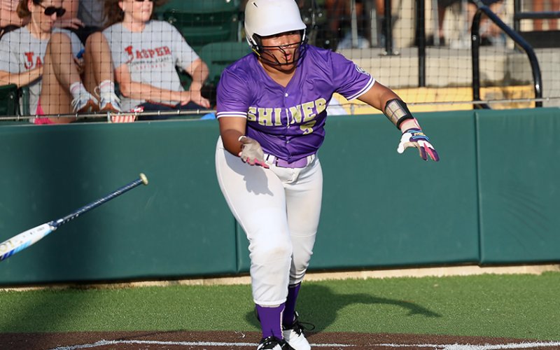 Patricia Price races off to first base after putting the ball into play. She got two hits and scored twice. Photo by Chuck Grafe/Hallettsville Tribune-Herald.