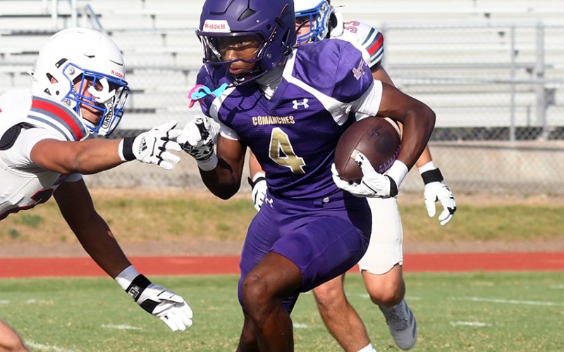 Senior running back Quincy Jones dodges Tidehaven defenders during the home scrimmage on Friday. Photo by Mark Lube.