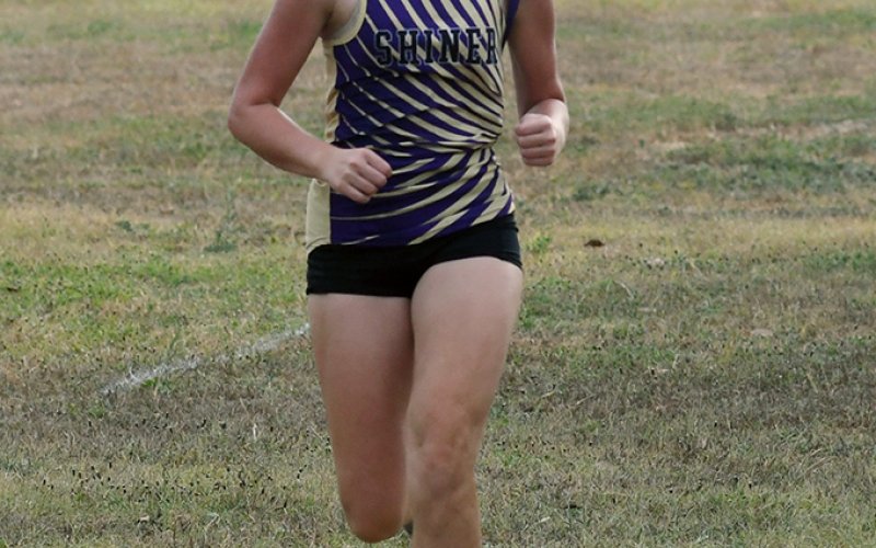 Alaina Sofka races down the hill towards the finish line. She had a time of 16:10.49 for a top 15 finish in the varsity girls 1A-2A division. Photo by Mark Lube.