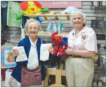 Pictured from left to right are Mary McQuillen and Nancy McNease of The Pink Ladies. They are holding handmade items available at Pink Hearts Gift Shop at the Yoakum Community Hospital.