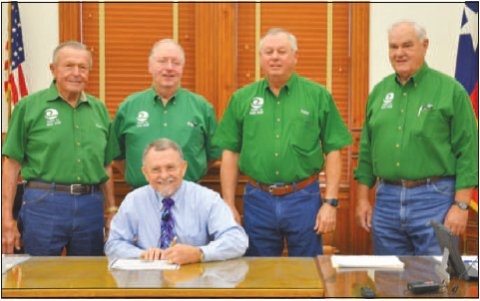 A proclamation was signed designating Soil and Water Stewardship Week, April 24- May 1. Pictured is Judge Daryl Fowler (seated). Pictured in the back row from left to right are directors Clem Waskow, Dwain Harbers, Finley Frels, and Leo Heinemann.