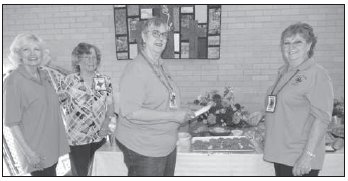 Pictured from left to right are Shiner Heritage Quilters Toni Rogers, Carolyn Schroeder, Kathleen Schacherl, and Debbie Novosad. They enjoyed snacks and desserts offered at the April 5 meeting to celebrate the successful Spring into Quilting Show held March 11 and 12
