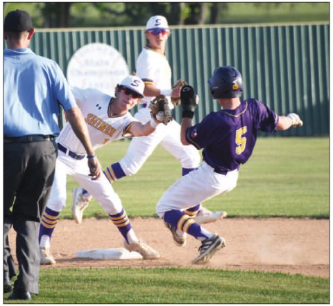 Shiner second baseman Jace Moeller attempts a tag out on a steal attempt by Weimar’s Brady Henke with shortstop Drew Wenske backing up the play Photo by Mark Lube.