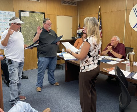 (Left) John S. Pelech and Michael Brandt repeated the oath office administered by City Clerk Theresa Bowe May 10.
