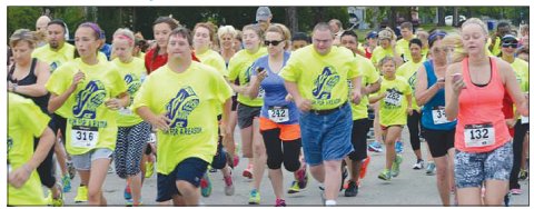 Pictured are walkers and runners participating in the 2014 Dash for Downs. Contributed photo.