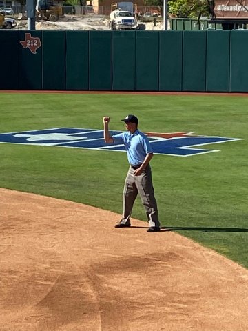 Robert Klekar indicates an out call during the Class 1A state championship game between Hermleigh and D'Hannis played Wednesday, June 1 at Red and Charline McCombs Field in Austin
