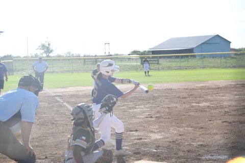 Ebey Johnson makes contact at the plate during Shiner’s second game vs Rockport-Fulton on Friday. Photo by Mark Lube.