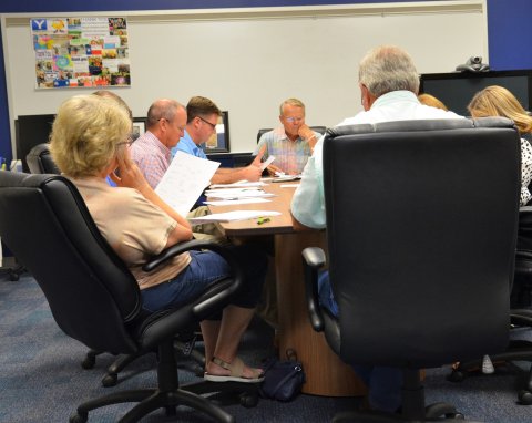 YISD trustees and administrators review budget information during the Aug 1 budget workshop in the YISD Administration Building. Photo by Hans Lammeman. 