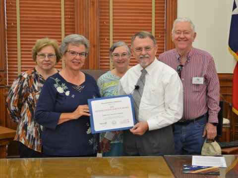 (Back from left) DeWitt County Historical Commission Vice Chairman Dianna Bartosh, Boardmember Barbara Nuckles, Boardmember Larry Nuckles, (Front from left) and Chairman Peggy Ledbetter receive the THC 2021 Distinguished Service Award presented by County Judge Daryl Fowler Monday, Sept. 26. Photo by Hans Lammeman. 