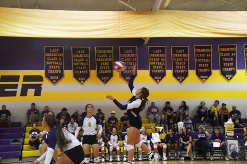Callie Sevcik with a hit. Photo by Mark Lube.