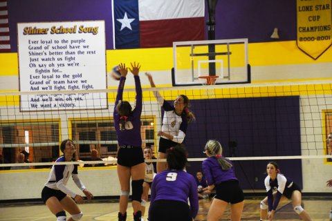 Weimar attempts to block an Aimee Mitchon hit. Photo by Mark Lube.