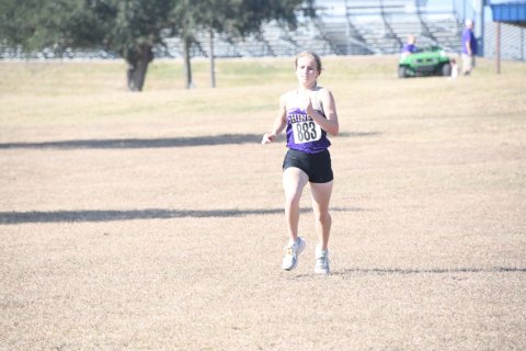 Hayleigh Burns and the rest of the Shiner Lady Comanches run late Friday morning at the state cross-country meet in Round Rock.Photo by Mark Lube.