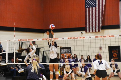 Julie Ivy attempts the block. Photo by Mark Lube.