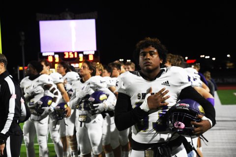 Sophomore Keenan Hailey during the National Anthem. Photo by Mark Lube.