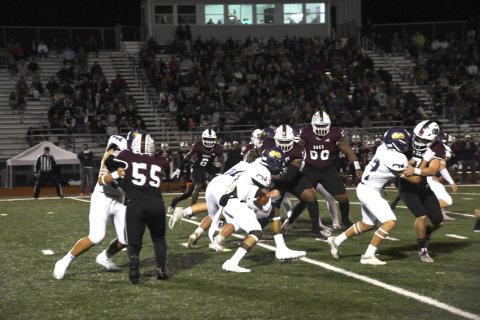 Dalton Brooks and his offensive line in the first half against Flatonia. Photo by Mark Lube.