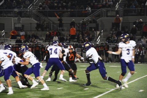 Dalton Brooks gets one of his 31 carries. Photo by Mark Lube.