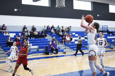 Callie Sevcik takes a shot in the game against Victoria East JV. Photo by Mark Lube.
