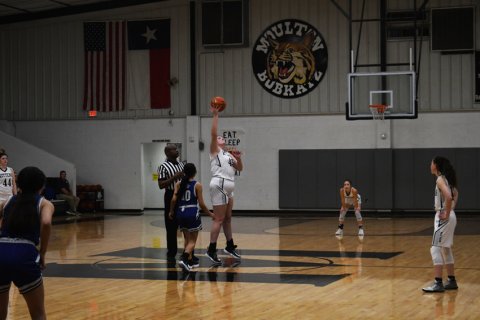 Mary-Claire O'Leary gets the upper hand on the opening tipoff. Photo by Mark Lube.