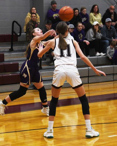 Megan Winkenwerder fires a pass to a teammate. Photo by Mark Lube.