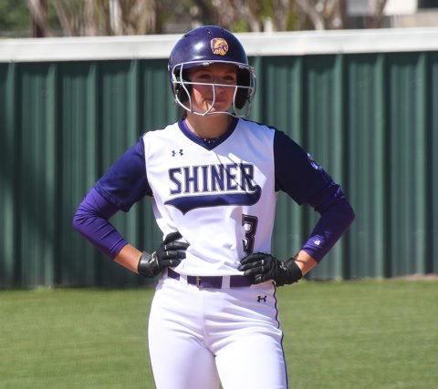 Riley Rainosek and the Shiner softball team are all smiles after three more district wins including a 27-0 win over Bloomington at home on Monday. Photo by Mark Lube.