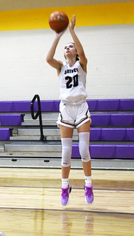 Lenehan attempting a shot in the first half of the Lady Comanches’ home game at Bloomington back on January 24.Lenehan scored seven points and hit a triple in Shiner’s 32-12 district victory. Photo by Mark Lube.