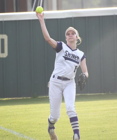 Shiner left fielder Aimee Mitchon makes a throw after fielding the ball in the first inning Friday against Flatonia. Photo by Mark Lube.