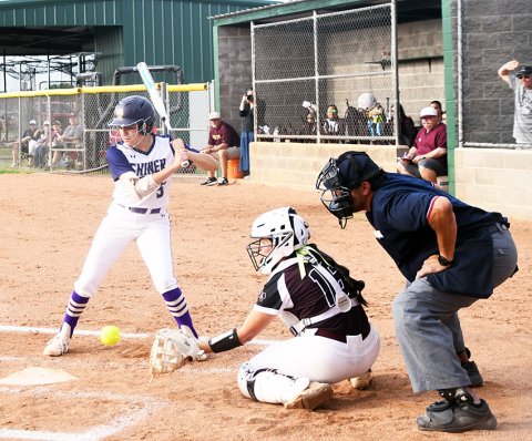 The Lady Comanches had enough hits at the plate at their two games last week in Louise and Bloomington to help them score 27 runs in both games. Photo by Mark Lube.