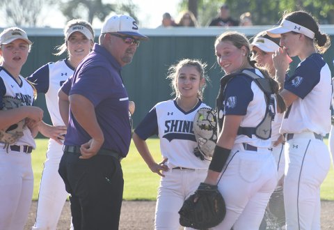 The Lady Comanches talk about strategy with head coach Jason Keller. Shiner beat Schulenburg and edged Ganado in home district action last week. Photo by Mark Lube.