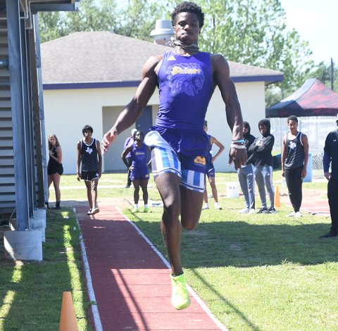 Dalton Brooks makes a jump during the long jump April 12 at the area-track meet in Weimar. He won the event as well as the 200-meter dash and was a part of the first place 400 and 800-relay teams. Photo by Mark Lube.