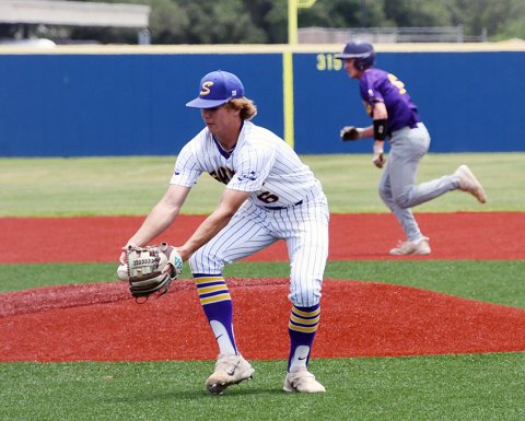 Pitcher Drew Wenske secures a fielded ball in the Game 2. Photo by Mark Lube.