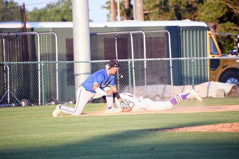 Cale Shows just beats the tag as he dives into third on a stolen-base attempt May 24 against Mumford. He led at the plate with two hits. Photo by Mark Lube.